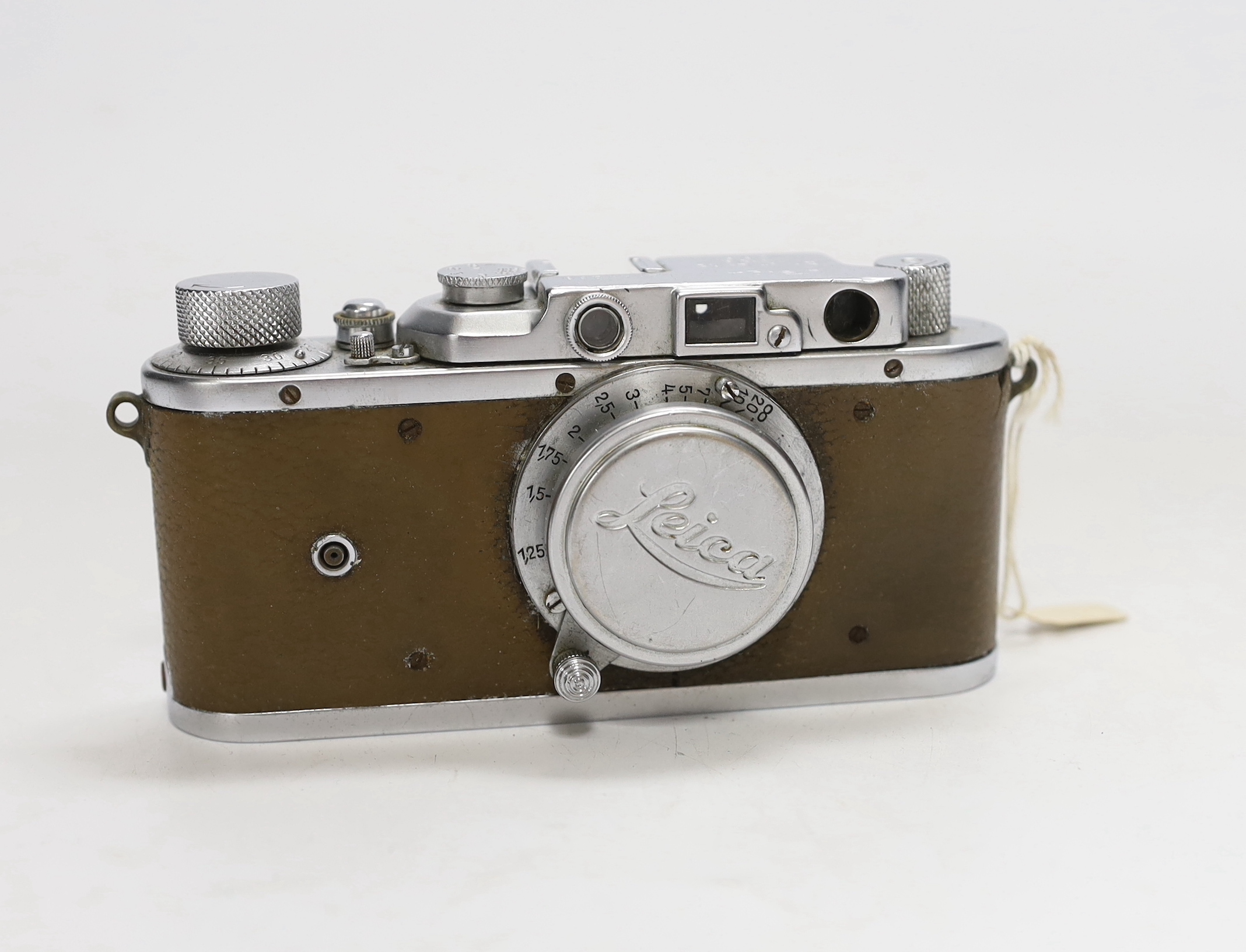 A Leica III camera, No.144286, with an Elmar f=5cm 1:3,5 lens, with leather case and strap